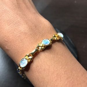 Gold bracelet with holographic gems